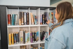 Pick Up Lockers 6 Library visitor using Bibliotheca smartShelf Borrow at Sunderland Libraries to return and borrow books quickly and intuitively.